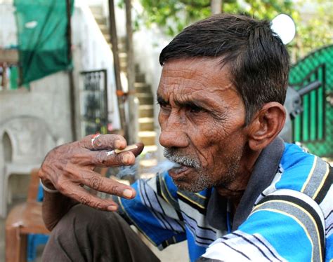 World No Tobacco Day' - Man smoking bidi