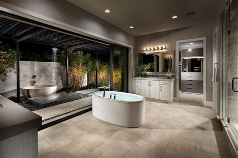 a large bathroom with an oval tub and walk in shower