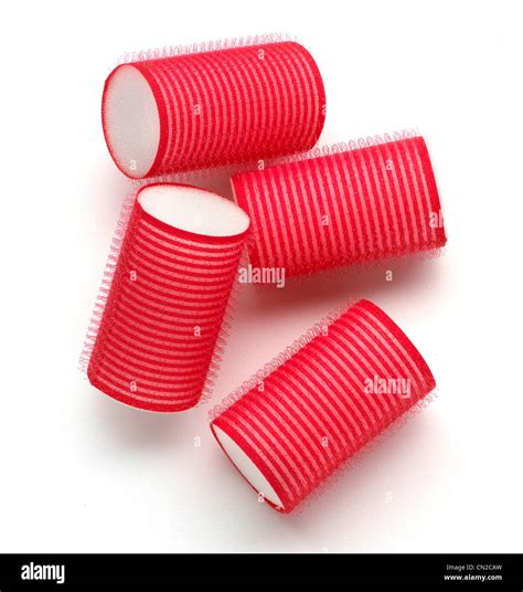 Set of red hair rollers Stock Photo - Alamy