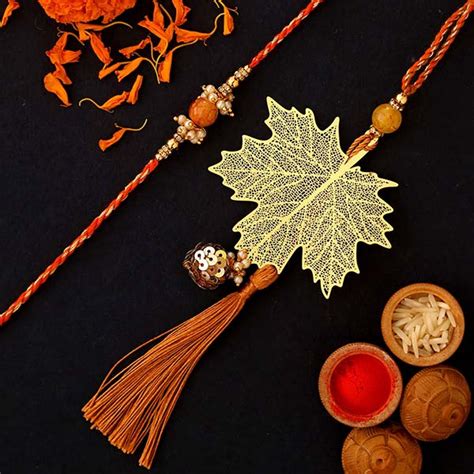 Send Maple Leaf Modern Design Lumba Rakhi Set Online | Rakhibazaar.com