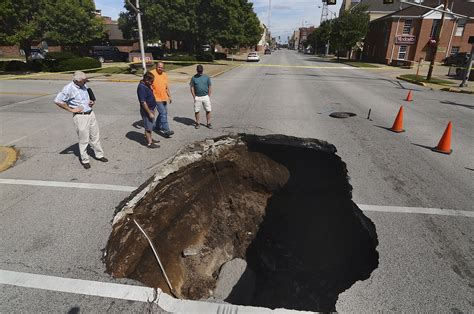 Large sinkhole opens in downtown Terre Haute street | AP News