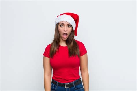 Young pretty woman with santa hat. christmas concept. | Premium Photo