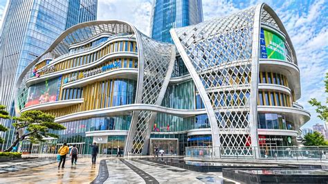 This futuristic mall features a massive glass waterfall inside building