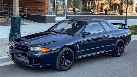 The difference between Nissan’s TH1 Pearl Blue on an R32 GT-R in standard light vs. direct ...