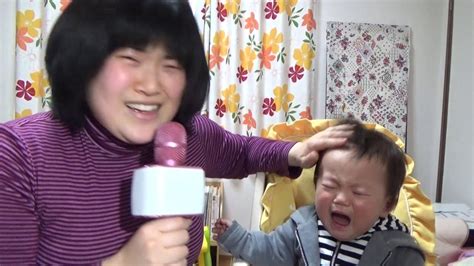 a Japanese mother and a son sing कुछ कुछ होता है kuch kuch hota hai.