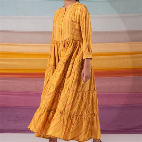 Symmetrical mustard stripe ensemble with kantha increments ...