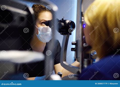 Slit Lamp Eye Examination with Ophthalmologist. Patient during Visit by ...