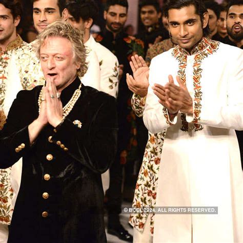 A model walks the ramp for designer Rohit Bal during the finale of FDCI ...