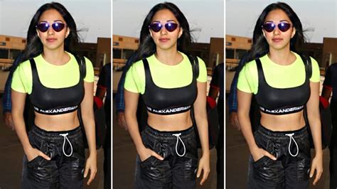 Kiara Advani wears a neon crop top and black joggers at Mumbai airport ...