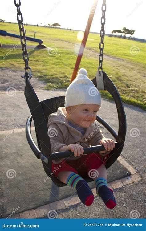 Baby in outdoor swing stock photo. Image of outside, happiness - 24491744