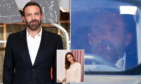 Ben Affleck has a cigarette in his mouth as he drives by ex Jennifer ...
