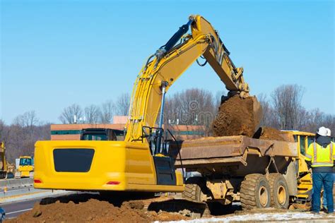 Image result for Large Excavators Loading Trucks
