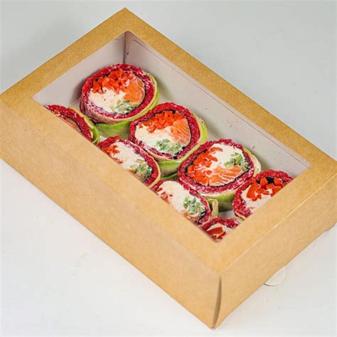 Assorted pastries overflowing in a box | Premium Photo
