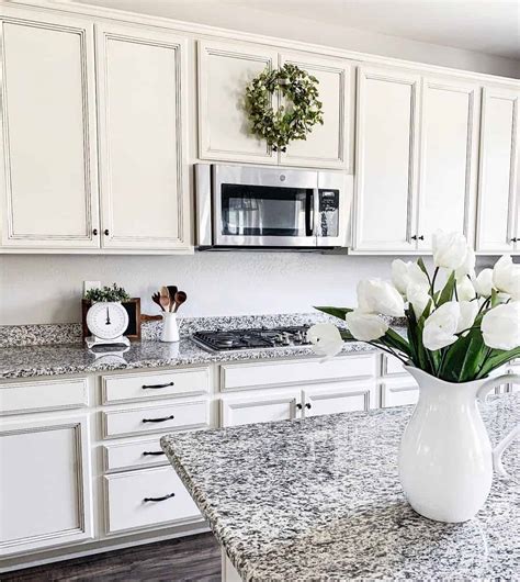 Kitchen with White Flowers on Granite Countertop with Matching ...