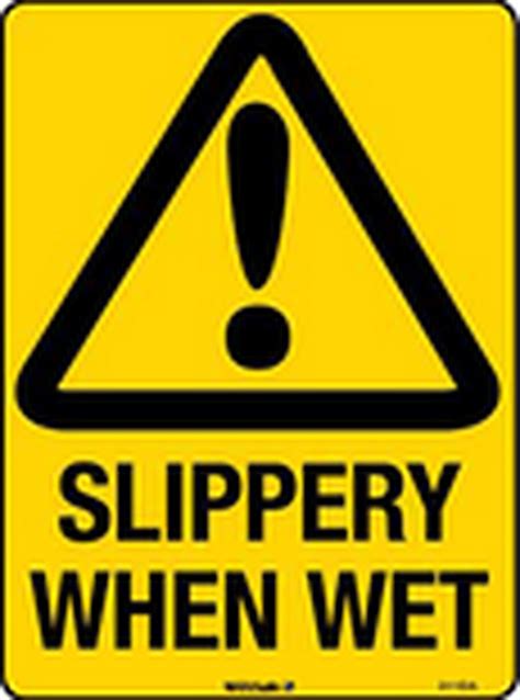 Yellow Slippery Road Signage · Free Stock Photo