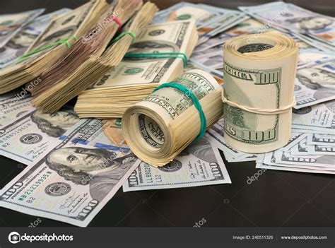 Stack Of 100 Dollar Bills On Table