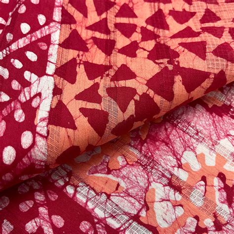 Off white, orange & red batik print saree – Roots Handloom