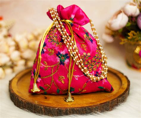 "Elegant Hot Pink Embroidered Potli Bag with Pearl Handle" – Devastram