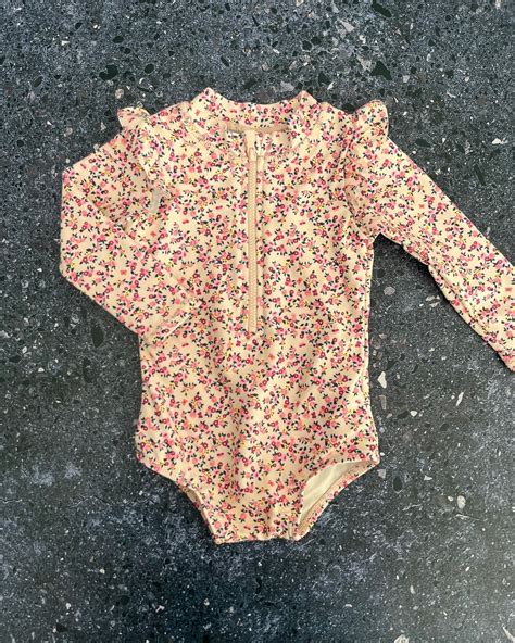 Cotton On beige floral swimming costume 3/6M – Nearly New Kids