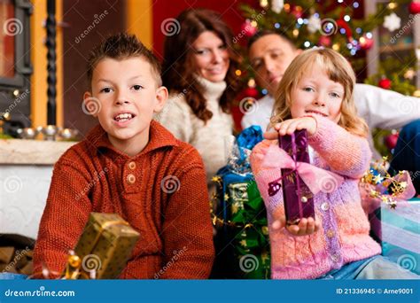 Christmas - Family with Gifts on Xmas Eve Stock Image - Image of girl ...