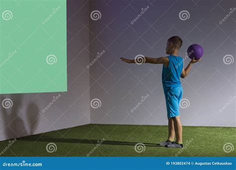 Kid Playing Interactive Game Projected To the Wall. Ball Games Concept ...