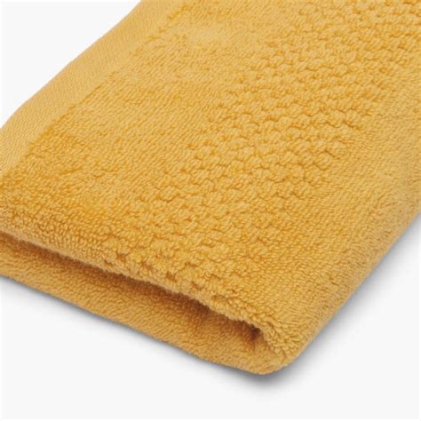 Buy SPACES Solid Textured Hand Towel from SPACES at just INR 245.0