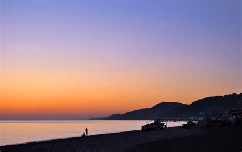 Panoramic view of sunset sky and sea coast | Premium Photo
