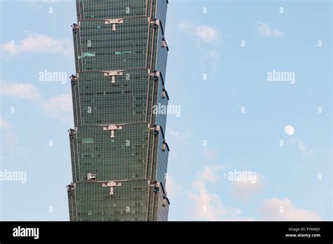 Photo of Taipei 101 tower against a blue sky.