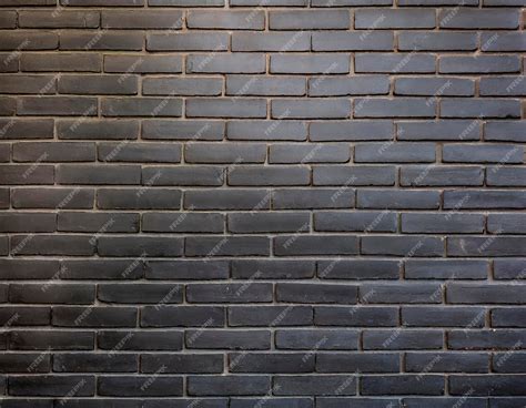Premium Photo | Black bricks wall texture or background