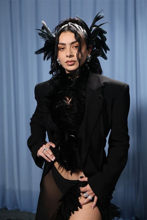 Charli XCX Brings Gothic Glamour—And a Dramatic Feathered Headpiece—to the 2025 Met Gala | Vogue