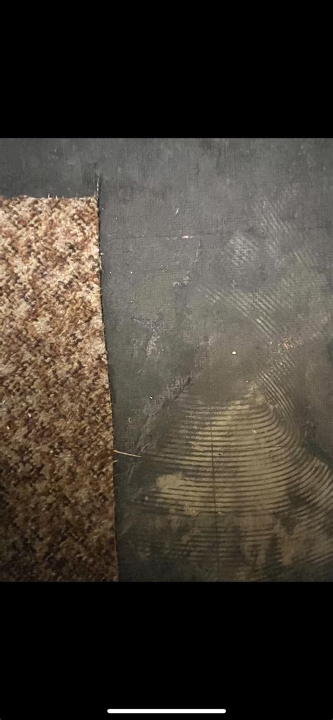 Black substance under carpet. Asbestos? : r/Flooring