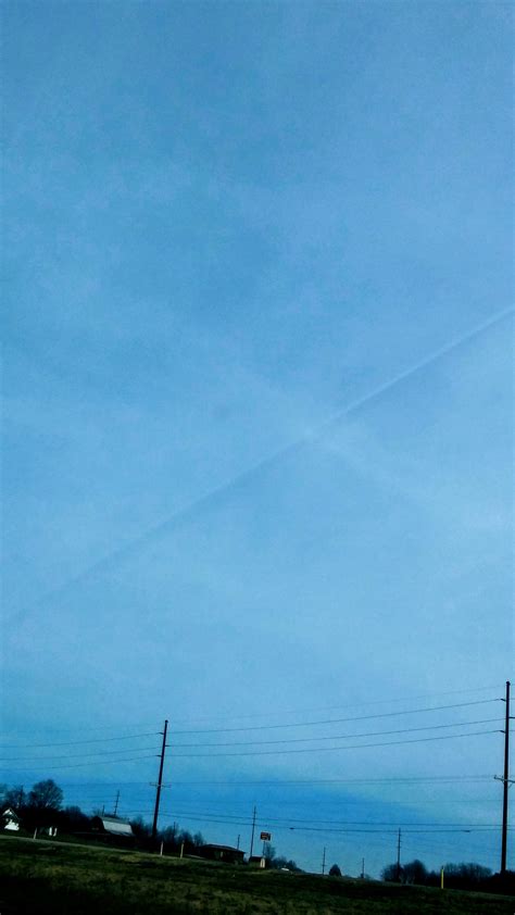 Jet stream casting a shadow on the clouds above it. Looks like a tear ...