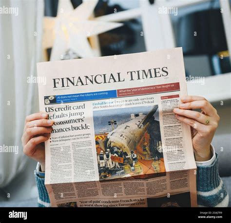 Paris, France - Jan 10, 2025: A woman reading the Financial Times with ...