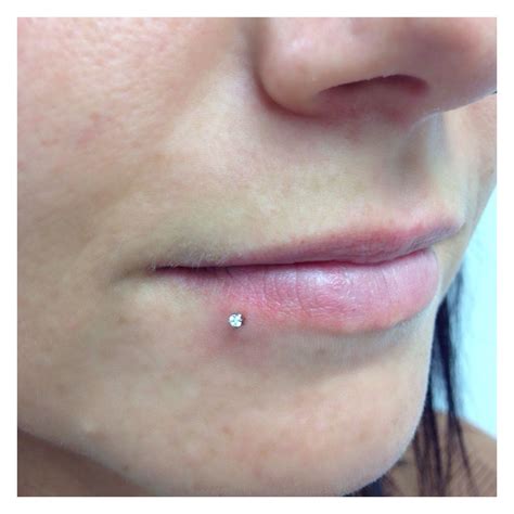 Side lip piercing done with a genuine White Swarovski Crystal from neo ...