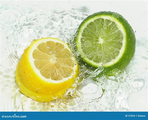 Lime vs Lemon stock photo. Image of splash, food, beverage - 27024