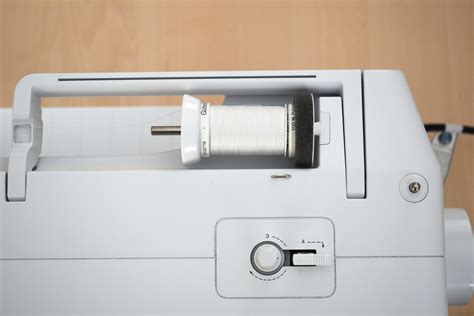 Image result for How to Use Large Thread Spool On Machine