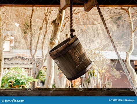 Old Antique Water Well Wooden Bucket with Rope Stock Photo - Image of ...