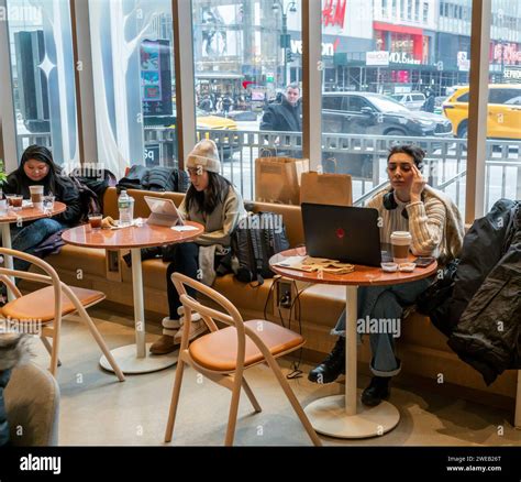 Customers and potential customers celebrate the grand opening of a ...