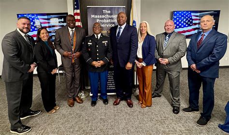 Lowell District Court Probation Officer James Biggs is presented with ...