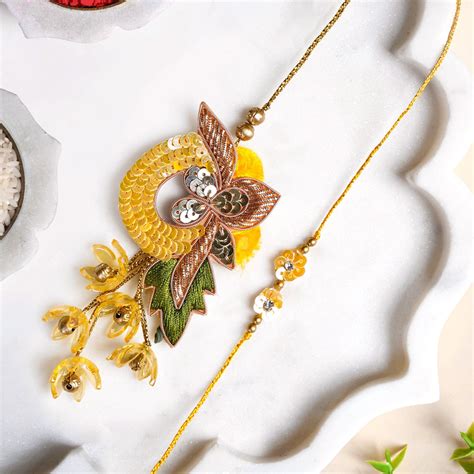Sunlit Amber Petal Rakhi Lumba Set Online - Premium Gift Hamper | Nestasia