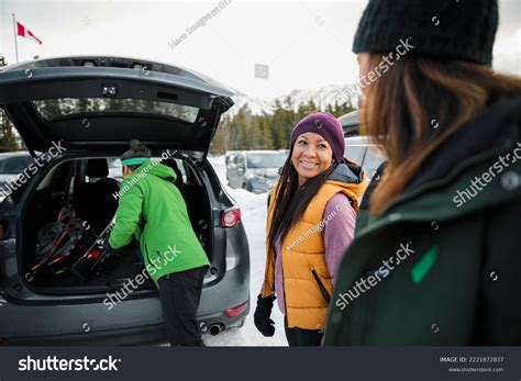 Smiling Friends Unloading Ski Equipment Car Stock Photo 2221872837 ...