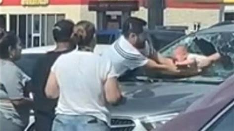 Viral Video: Heroic Father Smashes Windshield to Rescue Crying Baby ...
