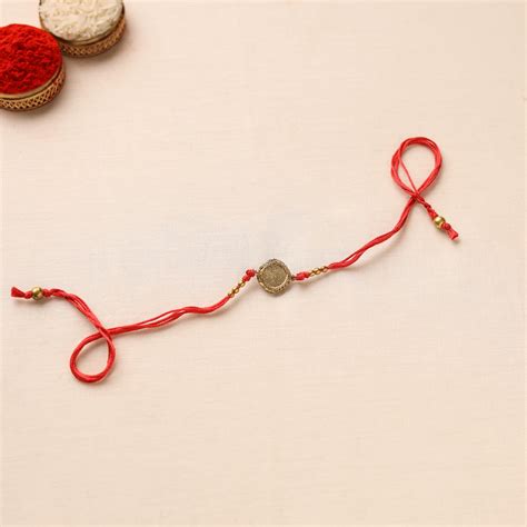 Tribal Dokra Craft Brass Rakhi by Miharu – iTokri आई.टोकरी