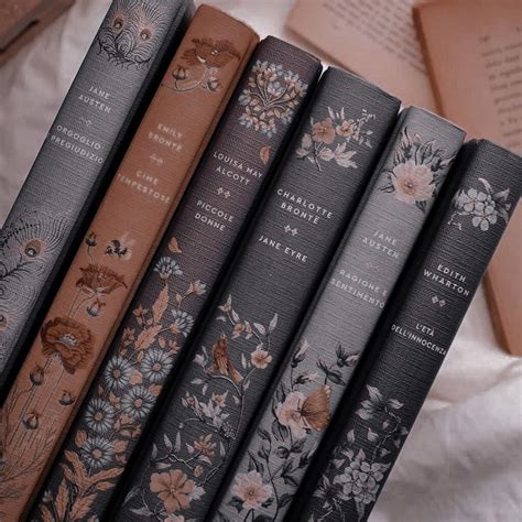 four books sitting on top of each other in front of an open book case ...