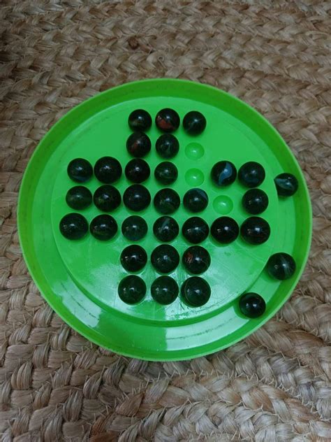 Brainvita Mind Challenging Board Game with 32 Marbles