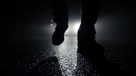 Person walking outside on dark spooky street at night 25547774 Stock ...
