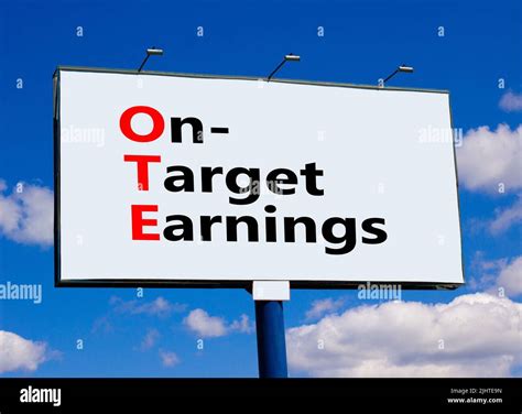 OTE on-target earnings symbol. Concept words OTE on-target earnings on big white billboard ...
