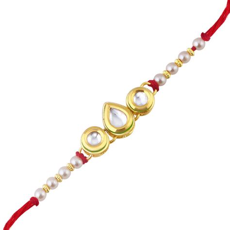 Sukkhi Astonish Gold Plated Kundan Rakhi for Brother with Roli chawal ...