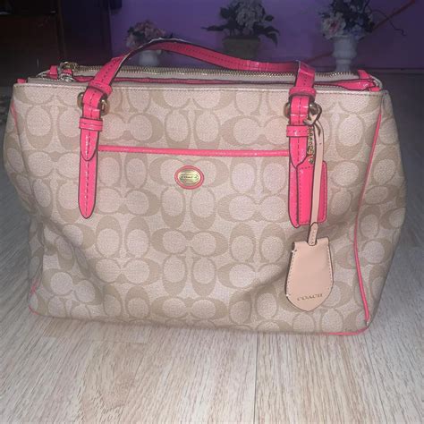 This beige and neon pink handbag features a classic... | Depop