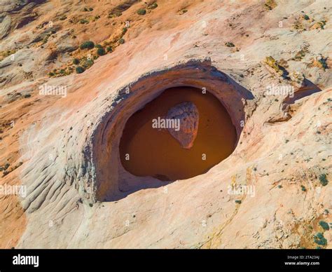 Photograph of the Cosmic Ashtray, a uniquely eroded sandstone formation ...